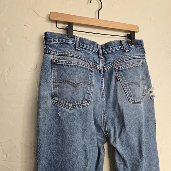 Vintage Levi's 557 Cowboy Distressed Jeans